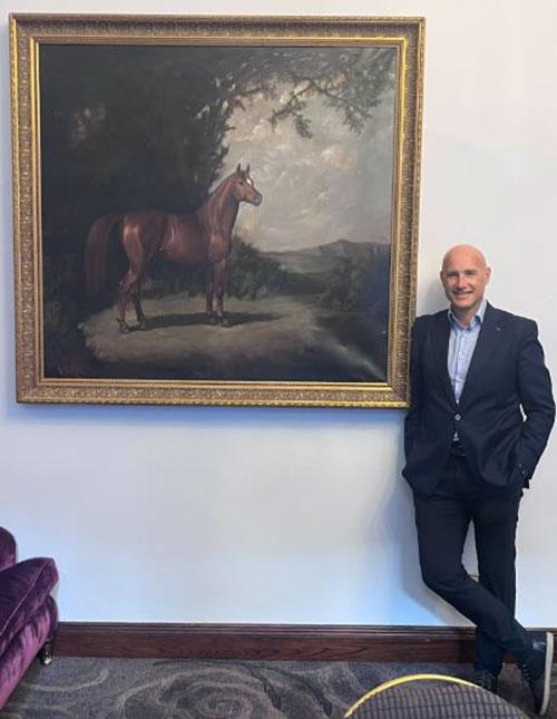 Kerim next to painting